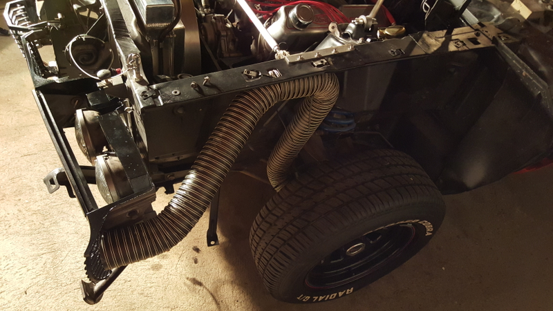 One meaty cooling duct aimed right at the brakes—a necessity on a big, heavy car.